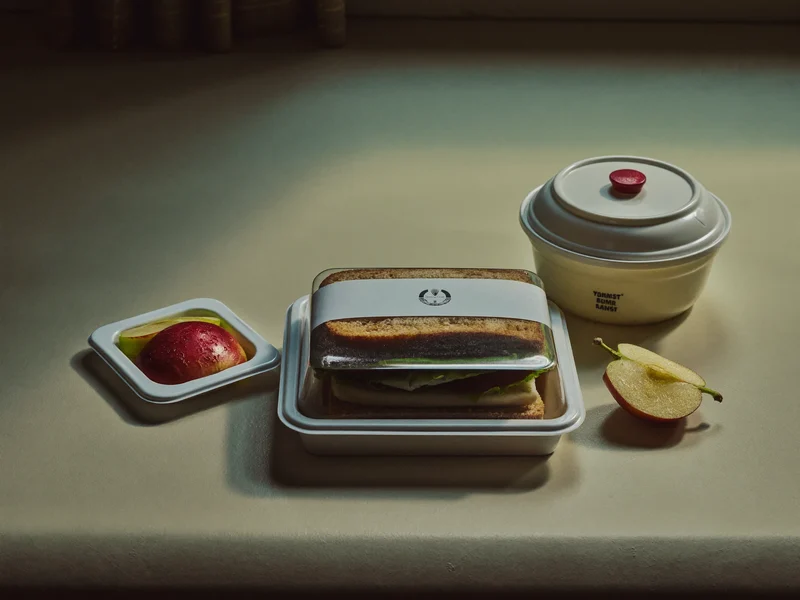 Illustration: a chilled lunch pack with sandwich, apple slices and yoghurt in plain packaging