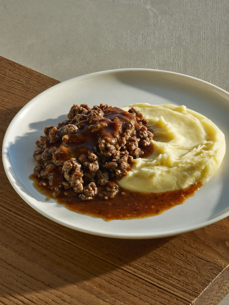 Illustration: softly plated minced beef with smooth mashed potato and gravy